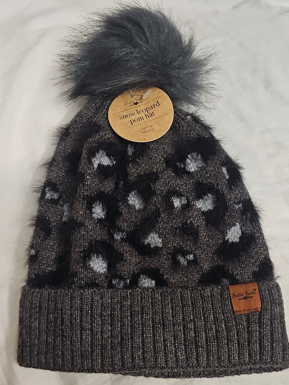Britt's Knitt Snow Leopard Pom Beanie Hat in Gray Bkack Animal Print